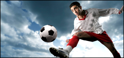 Man Kicking Soccer Ball
